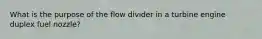 What is the purpose of the flow divider in a turbine engine duplex fuel nozzle?