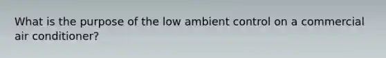 What is the purpose of the low ambient control on a commercial air conditioner?