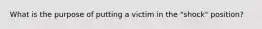 What is the purpose of putting a victim in the "shock" position?