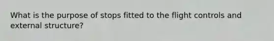 What is the purpose of stops fitted to the flight controls and external structure?