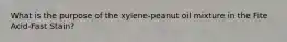 What is the purpose of the xylene-peanut oil mixture in the Fite Acid-Fast Stain?