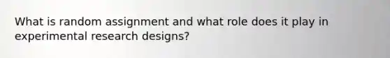 What is random assignment and what role does it play in experimental research designs?