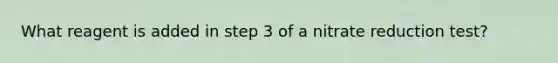 What reagent is added in step 3 of a nitrate reduction test?