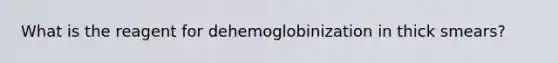 What is the reagent for dehemoglobinization in thick smears?