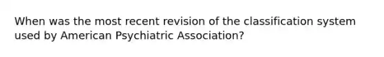 When was the most recent revision of the classification system used by American Psychiatric Association?