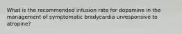 What is the recommended infusion rate for dopamine in the management of symptomatic bradycardia unresponsive to atropine?