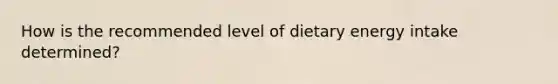 How is the recommended level of dietary energy intake determined?