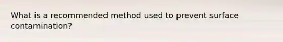 What is a recommended method used to prevent surface contamination?