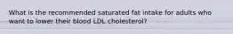 What is the recommended saturated fat intake for adults who want to lower their blood LDL cholesterol?