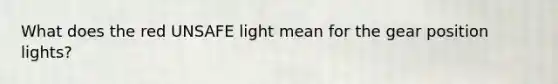 What does the red UNSAFE light mean for the gear position lights?