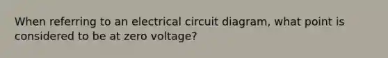 When referring to an electrical circuit diagram, what point is considered to be at zero voltage?