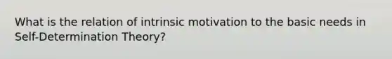 What is the relation of intrinsic motivation to the basic needs in Self-Determination Theory?