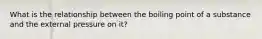 What is the relationship between the boiling point of a substance and the external pressure on it?