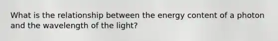 What is the relationship between the energy content of a photon and the wavelength of the light?