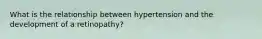 What is the relationship between hypertension and the development of a retinopathy?