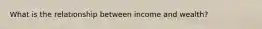 What is the relationship between income and wealth?