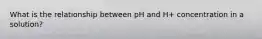 What is the relationship between pH and H+ concentration in a solution?