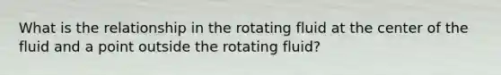 What is the relationship in the rotating fluid at the center of the fluid and a point outside the rotating fluid?