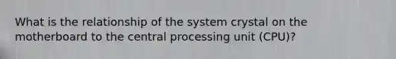 What is the relationship of the system crystal on the motherboard to the central processing unit (CPU)?