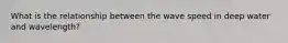 What is the relationship between the wave speed in deep water and wavelength?