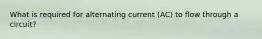 What is required for alternating current (AC) to flow through a circuit?