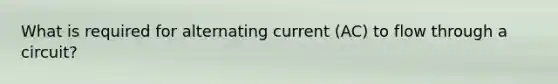 What is required for alternating current (AC) to flow through a circuit?