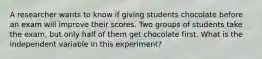 A researcher wants to know if giving students chocolate before an exam will improve their scores. Two groups of students take the exam, but only half of them get chocolate first. What is the independent variable in this experiment?