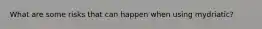 What are some risks that can happen when using mydriatic?