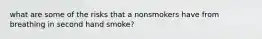 what are some of the risks that a nonsmokers have from breathing in second hand smoke?