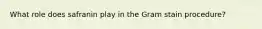 What role does safranin play in the Gram stain procedure?