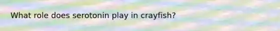 What role does serotonin play in crayfish?