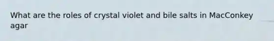 What are the roles of crystal violet and bile salts in MacConkey agar