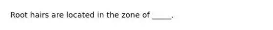 Root hairs are located in the zone of _____.