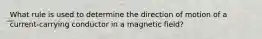 What rule is used to determine the direction of motion of a current-carrying conductor in a magnetic field?