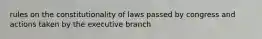 rules on the constitutionality of laws passed by congress and actions taken by the executive branch