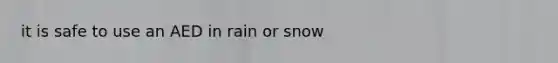 it is safe to use an AED in rain or snow