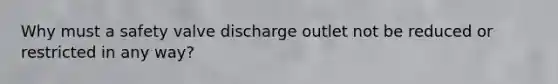 Why must a safety valve discharge outlet not be reduced or restricted in any way?