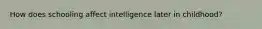 How does schooling affect intelligence later in childhood?