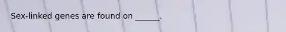 Sex-linked genes are found on ______.