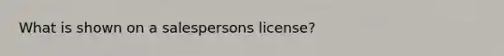 What is shown on a salespersons license?