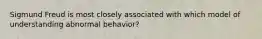 Sigmund Freud is most closely associated with which model of understanding abnormal behavior?