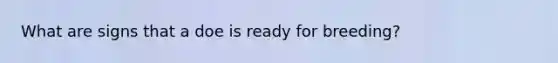 What are signs that a doe is ready for breeding?