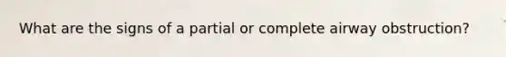 What are the signs of a partial or complete airway obstruction?