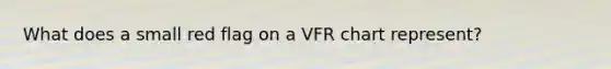 What does a small red flag on a VFR chart represent?