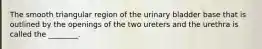 The smooth triangular region of the urinary bladder base that is outlined by the openings of the two ureters and the urethra is called the ________.