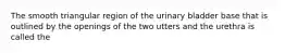 The smooth triangular region of the urinary bladder base that is outlined by the openings of the two utters and the urethra is called the