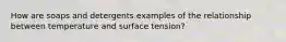 How are soaps and detergents examples of the relationship between temperature and surface tension?