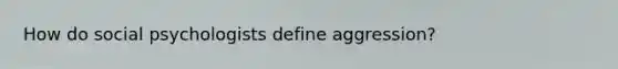 How do social psychologists define aggression?