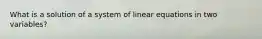 What is a solution of a system of linear equations in two variables?