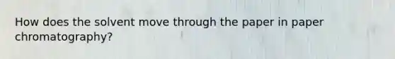 How does the solvent move through the paper in paper chromatography?